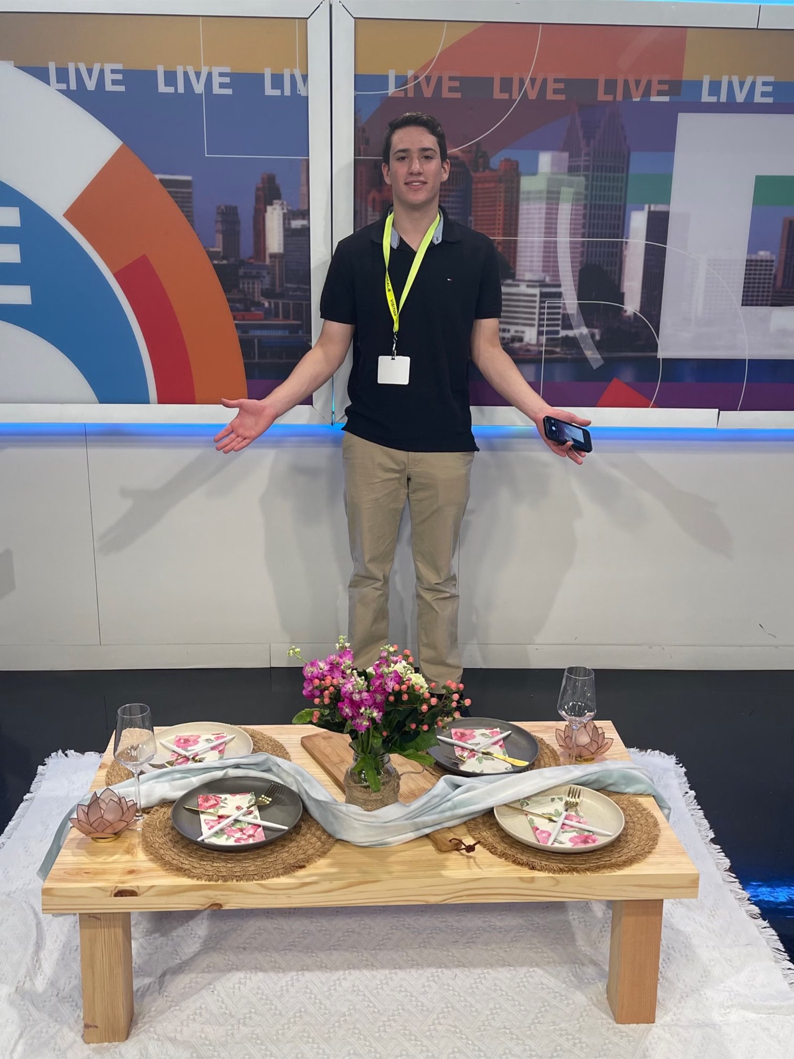 Yoel standing in front of his picnic setup at the studio