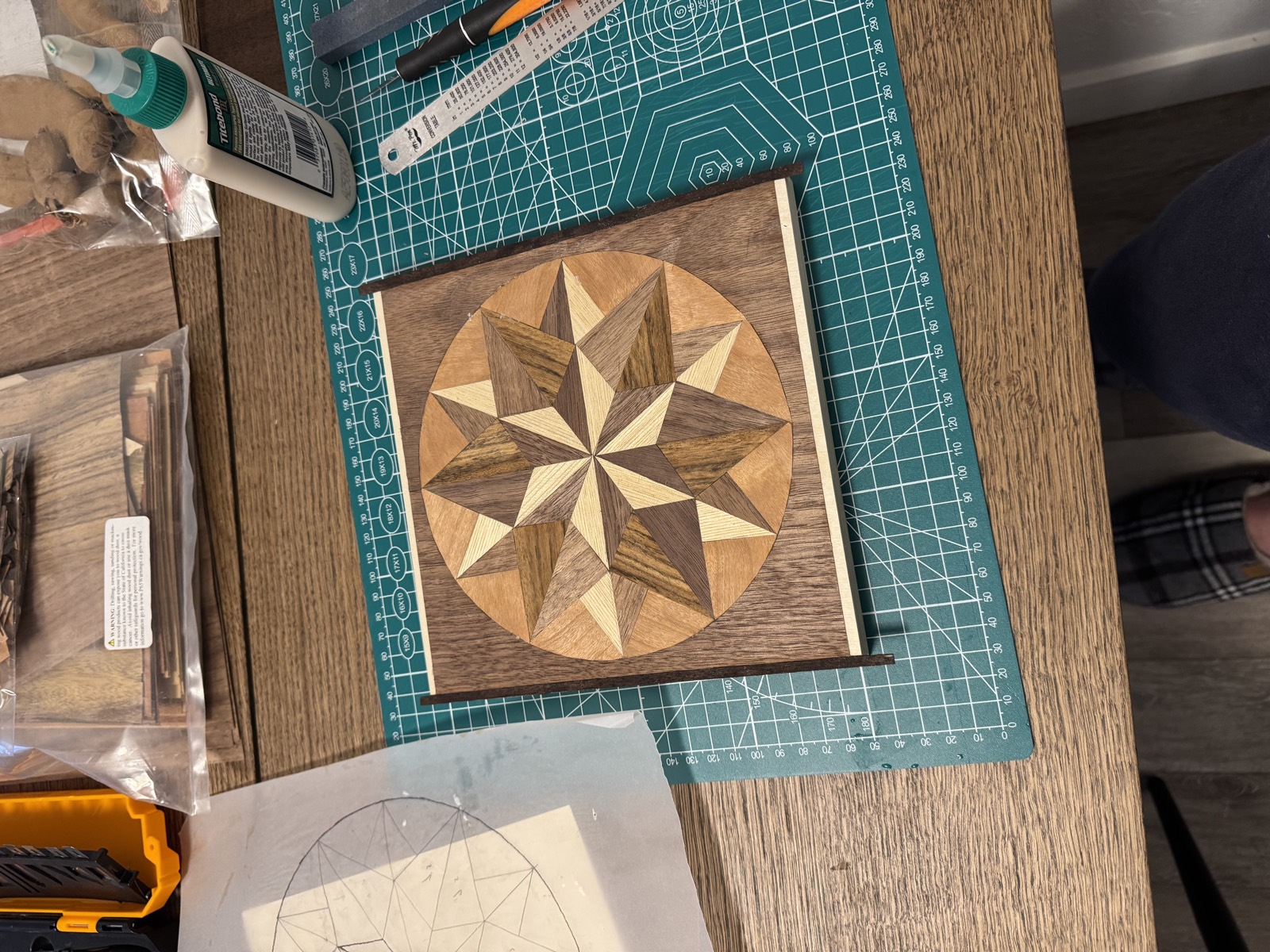 Thin border strips laid along the edges of the panel before gluing