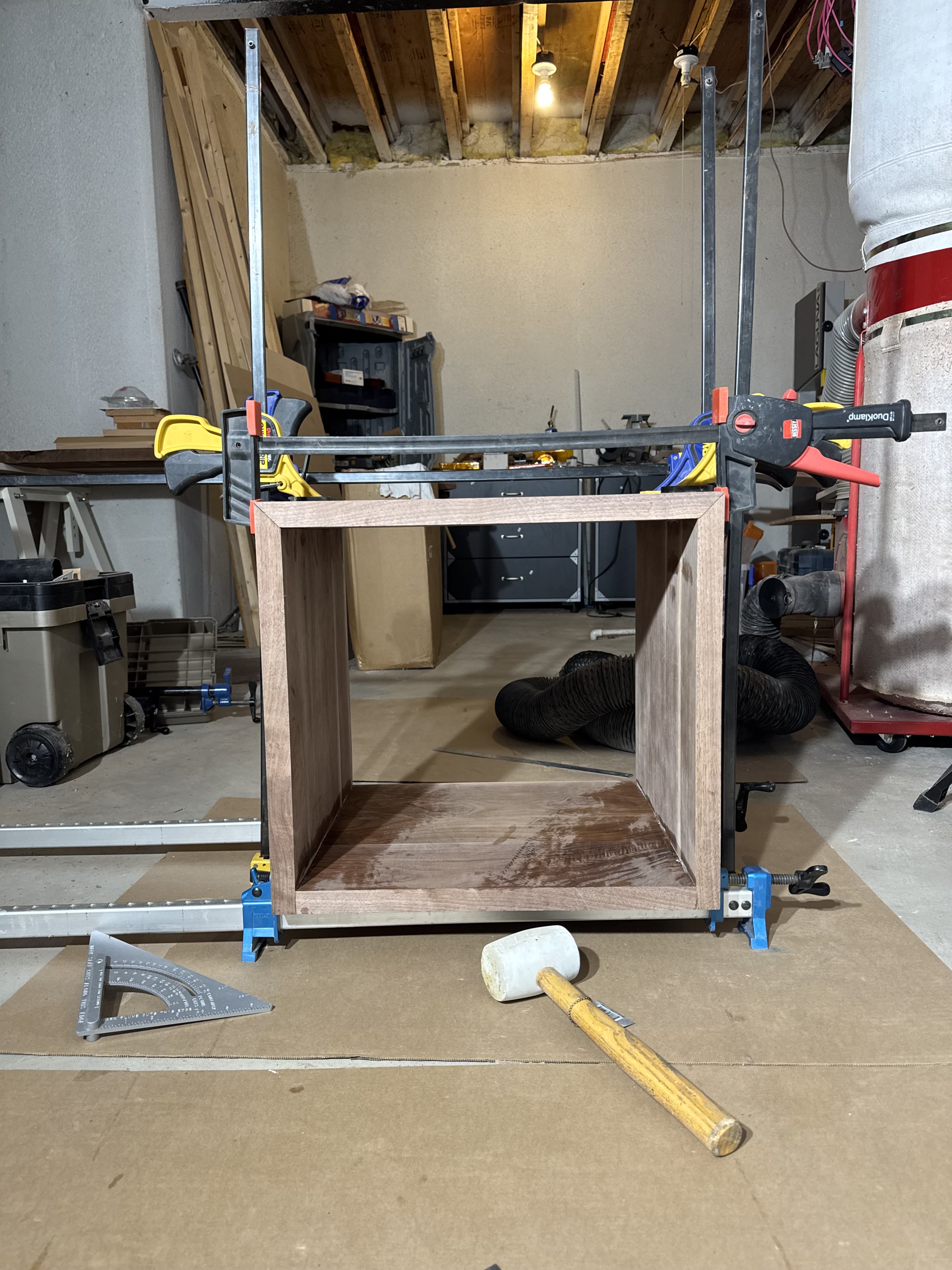 Walnut carcass clamped during glue-up