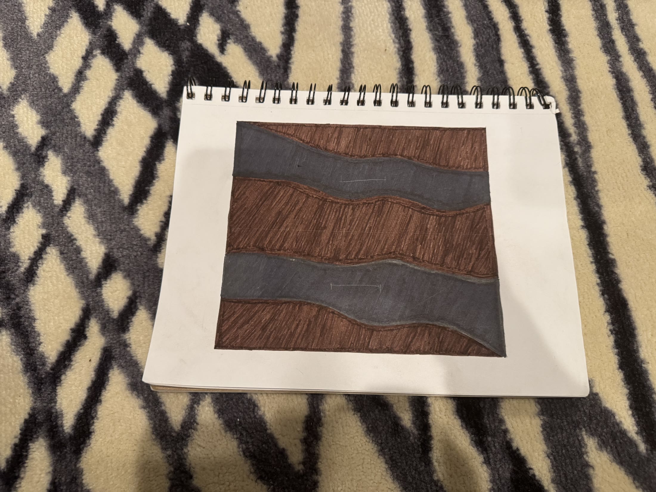 Marker sketch of the drawer-front design: a black wave cutting through walnut