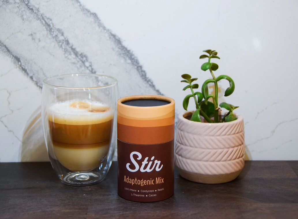 Stir canister styled with coffee for the product shoot