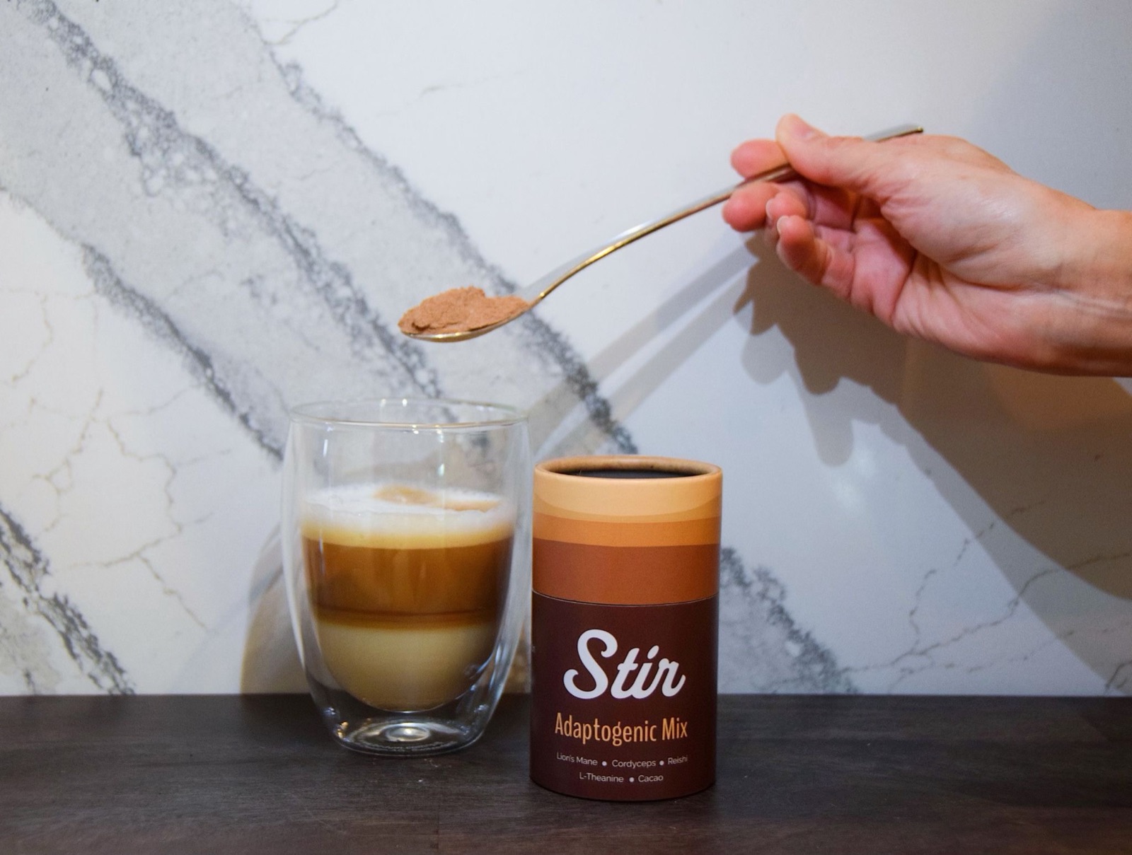 Stir canister photographed outdoors on a wooden table